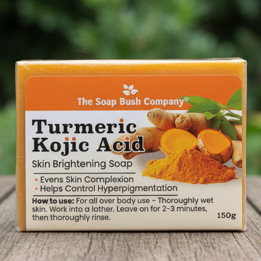 Bar of soap with 'The Soap Bush Company'and turme ric and kojic acid ingredients on a wooden surface. Soap Bush Kojic Acid Turmeric Skin Lightening Soap, Lightens Skin Complexion, Helps Control Hyperpigmentation, kojie san kojic soap, kojie san skin brightening soap, marie france Real Kojic Acid Soap  kojic acid soap, skin lightening, skin brightening, hyperpigmentation, turmeric, papaya,Clore Beauty Supply,Hair Mall, BSW, Rex, BCI, JNK, Mama Cee Beauty Supply, Miami Beauty Supply, Ricom, Hera Beau